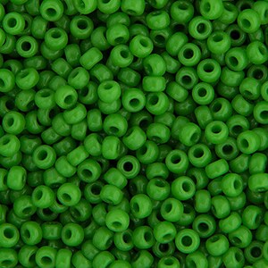 May include: A close-up image of a large quantity of small, round, green plastic beads. The beads are all the same size and shape, and they are arranged in a random pattern.