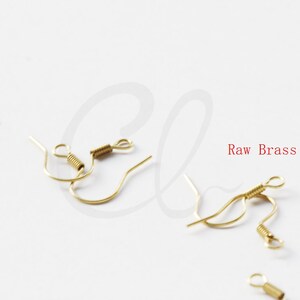 May include: Four gold-toned earring hooks with a spring closure. Raw Brass.