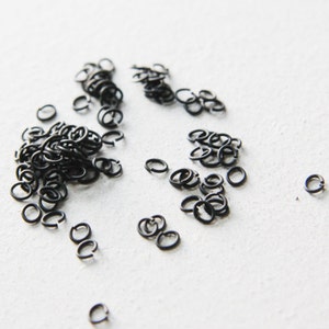 100 Pieces Matte Black Plated Brass Base Oval Jump Rings-5x4mm (21 Gauge) (319C-I-5G)