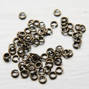 100 Pieces Antique Brass Plated Brass Base Opened Jump Rings-4mm (21 Gauge) (327C-I-14B)