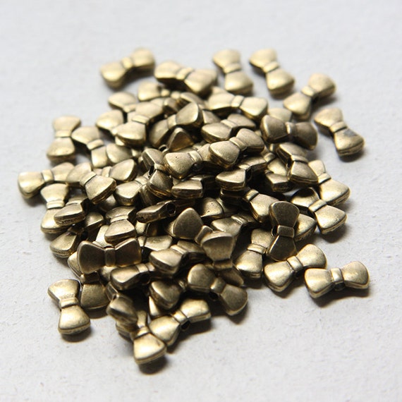 11777Y-F-401B 80pcs Antique Brass Tone Base Metal Spacers-Bow 10x5.5mm