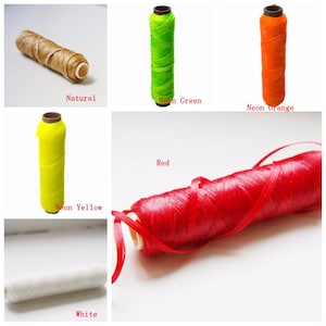 May include: A collection of spools of waxed thread in various colors, including natural, neon green, neon orange, neon yellow, red, and white. Each spool is cylindrical with a cardboard core, ideal for crafting and sewing projects.