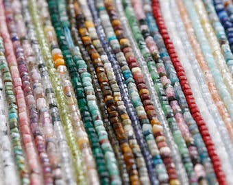 May include: Assortment of colorful gemstone beads in various shapes and sizes. The beads are arranged in rows, showcasing a wide variety of colors and textures.