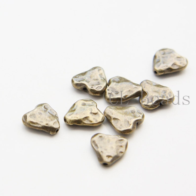 10 Pieces Zinc Based Based Alloy Spacer Textured Heart 10.5x10mm 26528Y Antique Brass