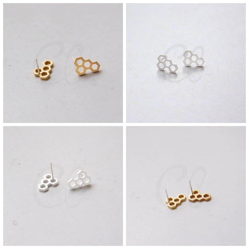 May include: Two pairs of honeycomb-shaped earrings, one pair in gold and one pair in silver.