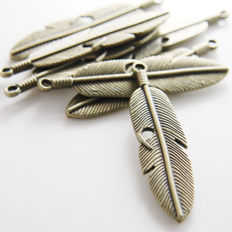 6 Pieces Antique Brass Tone Base Metal Charms-Feather 61x15mm 12720Y-D-132A33 image 1