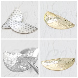 May include: Four hammered metal half-circle shapes in two different finishes: silver and gold. The metal pieces are textured with a hammered finish.
