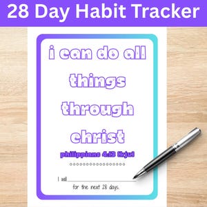 May include: A white 28-day habit tracker with a purple and blue border. The text "i can do all things through christ" is displayed in purple. A black and silver pen rests on the tracker. The text "Philippians 4:13 (kjv)" is also visible.