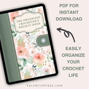 May include: A digital tablet displaying a project book titled THE ORGANIZED CROCHETER'S PROJECT BOOK with a floral pattern in shades of peach, green, and white. The cover features a sage green spine and a matching tab closure with a silver button.
