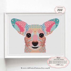 May include: Cross stitch pattern PDF of a colorful chihuahua with a geometric design. The pattern is 101 stitches wide by 74 stitches high and uses 27 DMC colors. The pattern can be stitched on Aida cloth in sizes 14, 16, or 18 count.