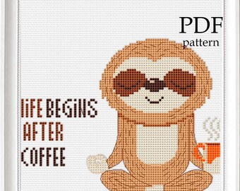 May include: Cross stitch pattern featuring a brown sloth meditating with a cup of coffee. The text "Life Begins After Coffee" is written in black.