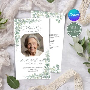 Peut inclure: Une carte commémorative avec une photo d'une femme souriante, encadrée par une bordure décorative de feuilles vertes. La carte indique "Célébrant la vie de Amelia R. Bennett, 14 mars 1934 - 2 juillet 2025." Le design comprend du texte et des accents floraux.