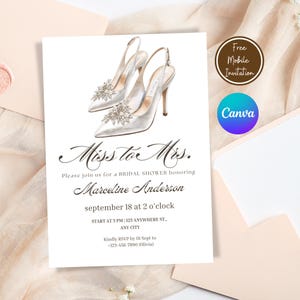 May include: Bridal shower invitation featuring a pair of elegant white satin high heels adorned with sparkling embellishments. The invitation text reads "Miss to Mrs." and includes event details, all set against a soft, neutral background.