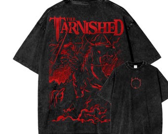 May include: Black graphic t-shirts featuring a red illustration and text. The larger shirt displays the words "THE TARNISHED" above a detailed image of a knight on horseback. The smaller shirt shows a red circular design.