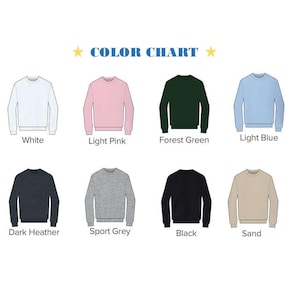 Puede incluir: Carta de colores que muestra ocho colores diferentes de sudaderas: blanco, rosa claro, verde bosque, azul claro, gris oscuro, gris deportivo, negro y arena.