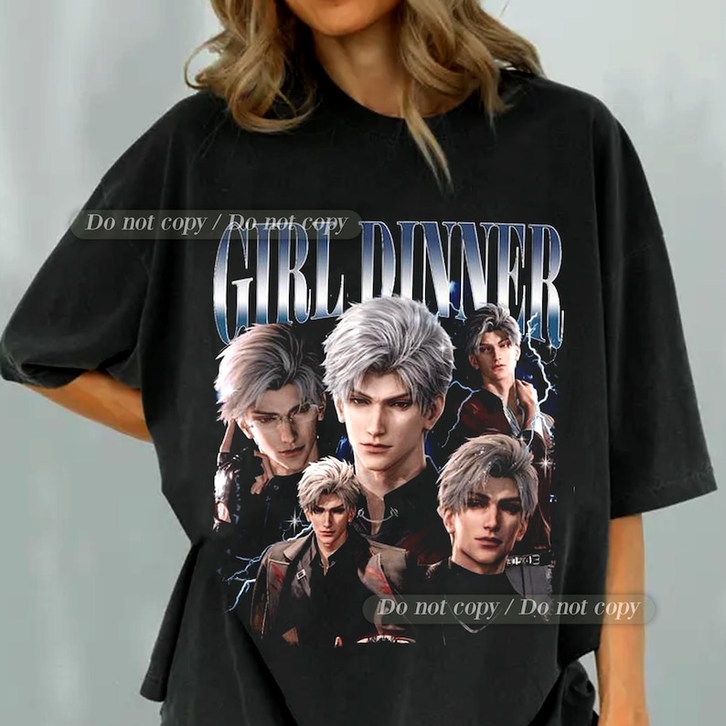 May include: Black t-shirt featuring a graphic of anime-style characters with silver hair and the text "GIRL DINNER" in a stylized font. The design includes lightning bolt accents and the phrase "Do not copy / Do not copy".