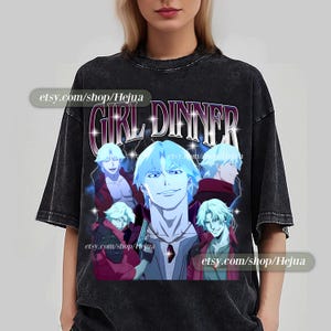 May include: Black t-shirt with a graphic print of anime characters and the text "Girl Dinner".