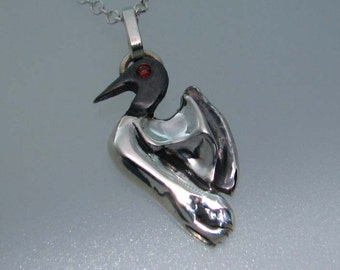 sterling silver diving loon pendant with  red garnet eye
