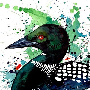May include: Watercolor painting of a loon bird in profile, featuring a dark green head and neck with a red eye. The bird's body is black with white spots and stripes. Green and blue paint splatters create a vibrant background.