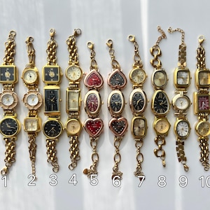 May include: A collection of ten vintage gold-toned wristwatches with various face shapes, including square, rectangular, oval, and heart. Each watch features a different colored face and is attached to a gold chain bracelet. The watches are numbered 1 through 10.