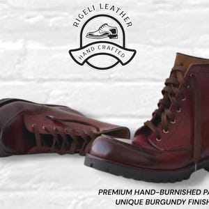 May include: A pair of burgundy leather boots with brown laces and thick black lug soles. The boots feature a hand-burnished patina finish. Above the boots is a logo reading RIGELI LEATHER HAND CRAFTED. Below is text: PREMIUM HAND-BURNISHED PATINA UNIQUE BURGUNDY FINISH.