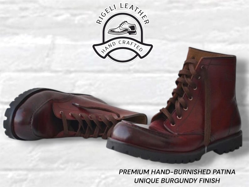 May include: A pair of burgundy leather boots with brown laces and thick black lug soles. The boots feature a hand-burnished patina finish. Above the boots is a logo reading RIGELI LEATHER HAND CRAFTED. Below is text: PREMIUM HAND-BURNISHED PATINA UNIQUE BURGUNDY FINISH.