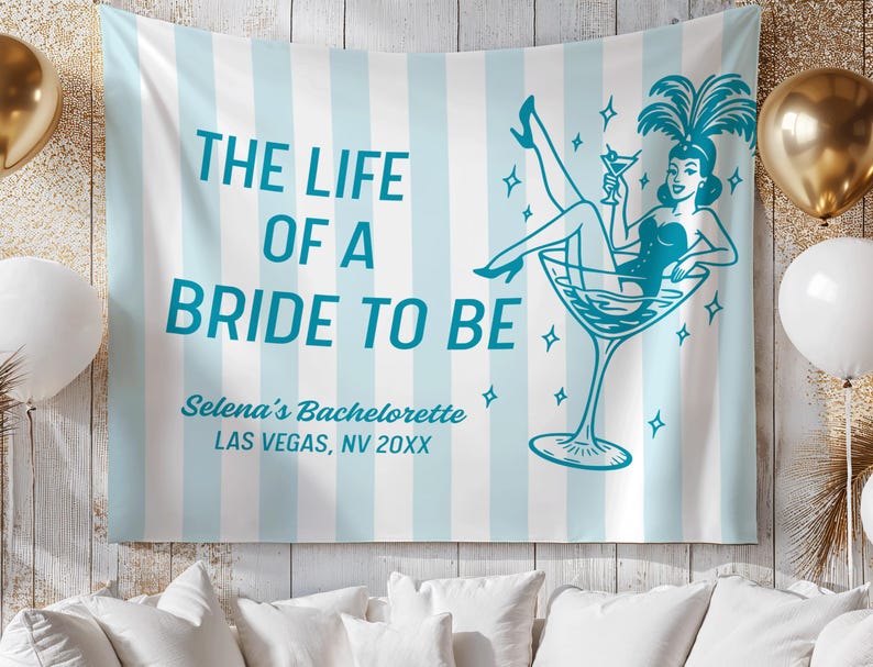 May include: A light blue and white striped tapestry with the text "THE LIFE OF A BRIDE TO BE". It features a teal illustration of a woman in a martini glass. The text "Selena's Bachelorette LAS VEGAS, NV 20XX" is also included.