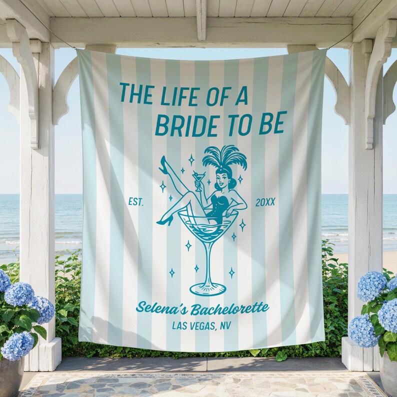 May include: A light blue and white striped bachelorette party banner with the text "THE LIFE OF A BRIDE TO BE". It features a teal illustration of a woman in a martini glass, with the text "Selena's Bachelorette, Las Vegas, NV".