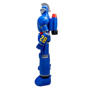 May include: A blue robot action figure with a silver helmet and accents. The robot has a red and black rocket pack and the number "28" in yellow on its arm. The figure is standing on a white background.