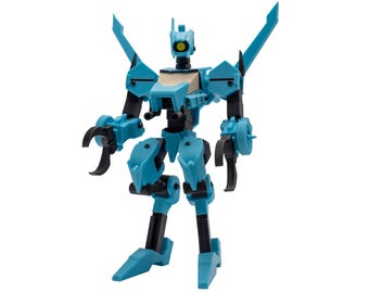 May include: A light blue and black robot action figure featuring a single yellow eye, claw-like hands, and two large wing-like protrusions extending from the shoulders. The mechanical figure has articulated joints and a central chest panel.
