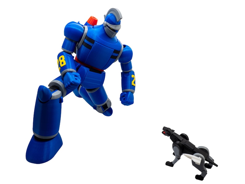 May include: A blue robot action figure with yellow number details and a silver helmet is posed in a dynamic stance. A smaller black and gray robotic dog figure is positioned nearby. The figures are set against a white background.