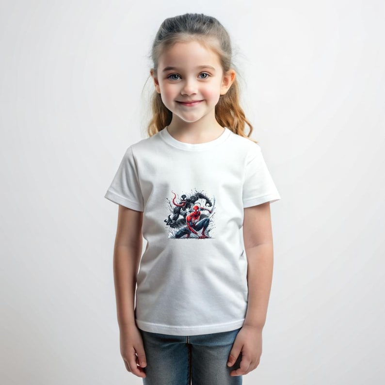 May include: A white t-shirt with a graphic print of Spider-Man and Venom fighting. The graphic is in black, red, and white.