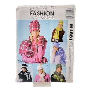 May include: McCall's Fashion Accessories sewing pattern envelope M4681 for fleece hats, scarves, and mittens. The cover displays six variations of winter accessories in plaid, solid, and patterned fleece fabrics with decorative accents and fringe.