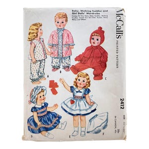 May include: Vintage McCall's sewing pattern for baby and girl doll wardrobes. The pattern features illustrations of various doll outfits, including pajamas, dresses, and a red fringed jumpsuit. The pattern is for dolls sized 23-25 inches.