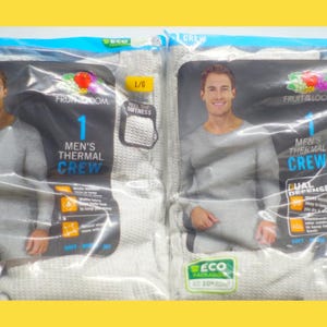 May include: Two packages of gray thermal underwear for men. Each package contains one thermal crew neck shirt. The packaging features the Fruit of the Loom logo and the text "1 Men's Thermal Crew".