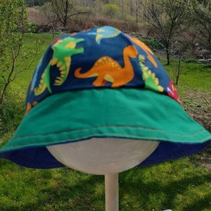 Reversible cotton bucket hat with dinosaurs and thomas the tank engine