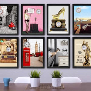 May include: A collection of framed art prints featuring clocks and various themes. The prints include a red scooter in an alley, a woman with a sign, a gold high heel, a surrealist painting, a stack of books, a red phone booth, a hammer, and a statue.