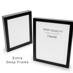 May include: Two black picture frames with white interiors are displayed against a white background. The text "HIGH QUALITY (ABS PLASTIC) FRAME" is visible on one frame. The words "Extra Deep Frame" are also visible.