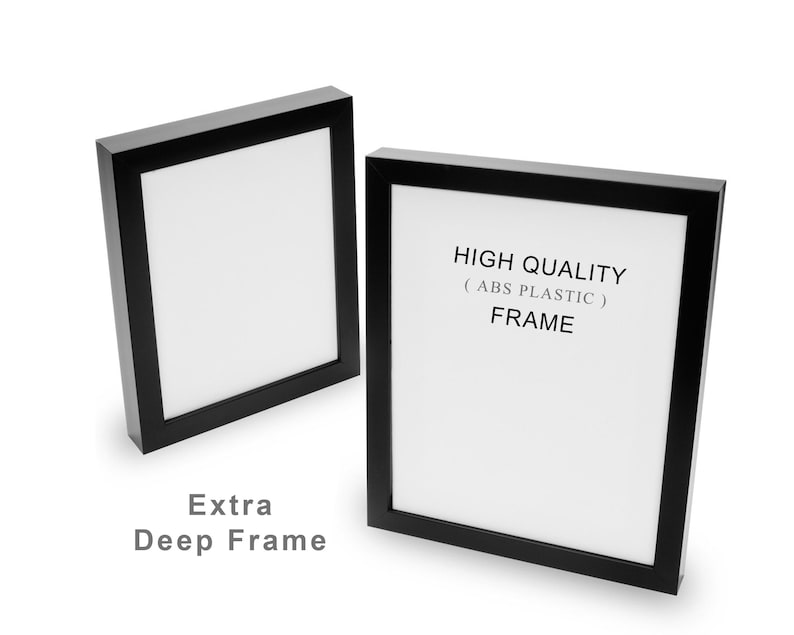 May include: Two black picture frames with white interiors are displayed against a white background. The text "HIGH QUALITY (ABS PLASTIC) FRAME" is visible on one frame. The words "Extra Deep Frame" are also visible.