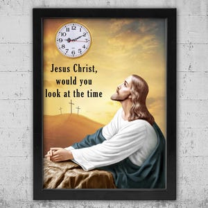 May include: Framed print featuring a clock and an image of Jesus Christ looking upwards. The text reads "Jesus Christ, would you look at the time." The clock has black hands and Roman numerals. The background shows a sunset and three crosses.