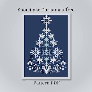 May include: A cross stitch pattern titled Snowflake Christmas Tree Pattern PDF. The design features a Christmas tree shape composed of various white and light blue snowflake motifs arranged on a solid dark navy blue background.