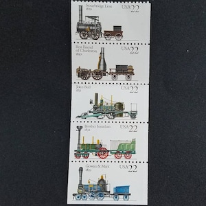 May include: A set of five vintage postage stamps featuring illustrations of early steam locomotives. The stamps are arranged vertically and each features a different locomotive with its name and year of construction. The stamps are all from the United States and have a denomination of 22 cents.
