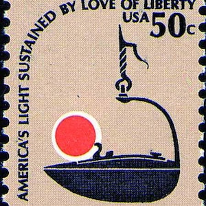 May include: A vintage postage stamp featuring a stylized illustration of a lamp with a red circle and the text "AMERICA'S LIGHT SUSTAINED BY LOVE OF LIBERTY USA 50c". The stamp has a beige background and a black border.