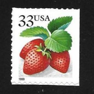 May include: A 33 cent USA postage stamp featuring a close-up of three red strawberries with green leaves.