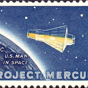 May include: A blue and white postage stamp with a 4-cent denomination. The stamp features a white spacecraft against a blue starry background with a partial view of Earth. The text "U.S. MAN IN SPACE PROJECT MERCURY" is printed on the stamp.