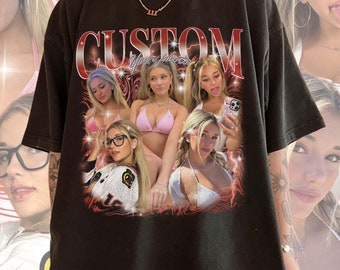 May include: Black oversized t-shirt with a graphic print of a collage of women's faces. The text "CUSTOM" is printed in red on the shirt.