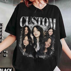 May include: Black t-shirt with a graphic print of four women with the word "CUSTOM" in silver lettering.