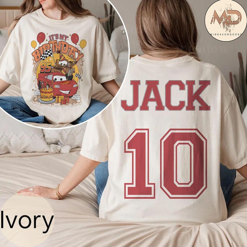 May include: Ivory t-shirt with a red cartoon car and the text "It's My Birthday!" on the front. The back of the shirt has the name "JACK" and the number "10" in red.