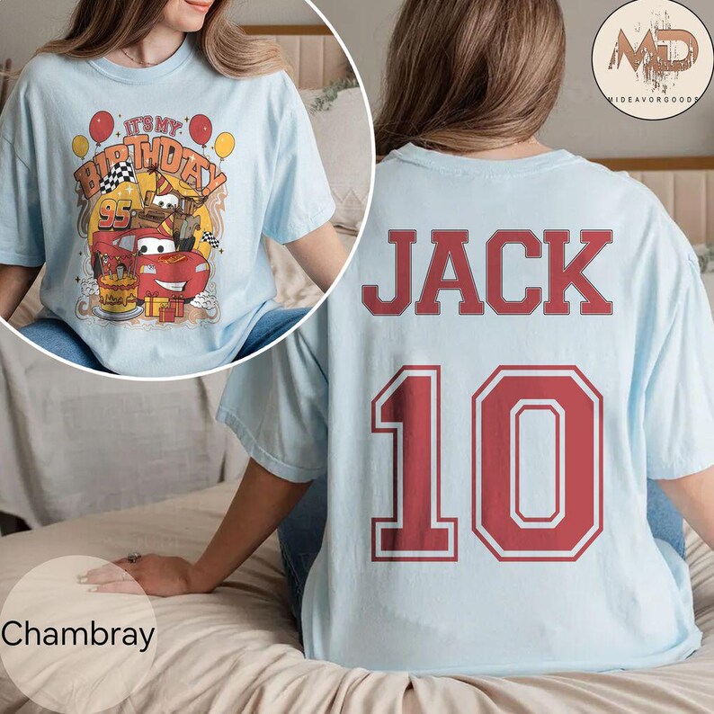 May include: Light blue t-shirt with a red car and the text "It's My Birthday" on the front. The back of the shirt has the name "JACK" and the number "10" in red.