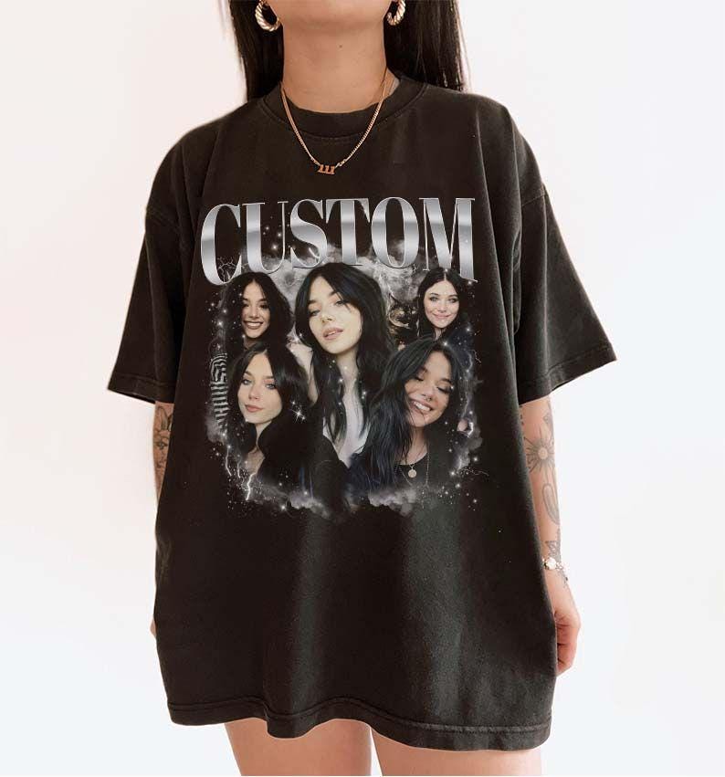 May include: Black oversized t-shirt with a graphic print of five women's faces and the word "CUSTOM" in silver lettering.